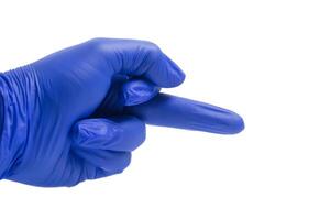 Blue gloved hand showing obscene gesture with middle finger on white background. Closeup photo