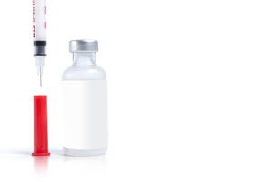 Vaccine bottle and syringe isolated on white background with copy space. photo