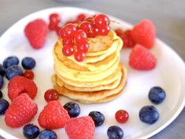 pancakes on a white plate, selective focus photo
