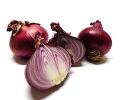 Red whole and sliced onion, isolated on white background. Big red onion photo