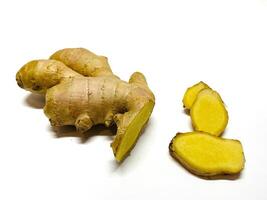 Ginger root with sliced on white background photo