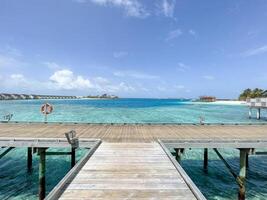 The bridge along the ocean at Maldives photo