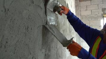 Cement mixing for plastering is a skill of plastering that is accurate and highly skilled. video