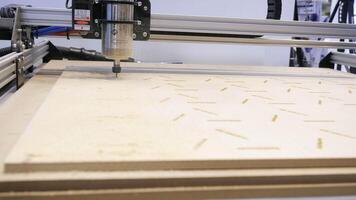 Close-up of carpenter's machine cutting wooden boards. Media. Beautiful patterns on wood with automated machine. Wood carving by automated machine video