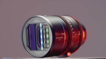 GERMANY, BERLIN - MARCH 21, 2022. Large wide angle lens. ACTION. Showing a new lens on a purple background. Large zoom lens for SLR camera video