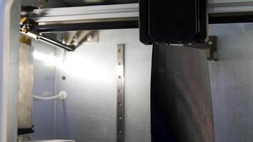 Automated technical 3d printer. Media. 3D printer creates tall object. Large automated 3d printer video