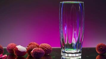 Drink with ingredients is poured into transparent glass. Stock clip. Bright drink with gases is poured into glass. Ingredients of drink poured into glass video