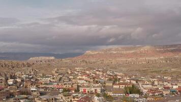 Aerial view of ancient region Cappadocia in Turkey. Action. Beautiful city on a cloudy sky background, concept of tourism and travelling. video