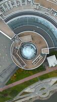 Top view of futuristic architecture of roof of building. Stock footage. Circular roof with stylish architectural design. Beautiful futuristic design of modern building video