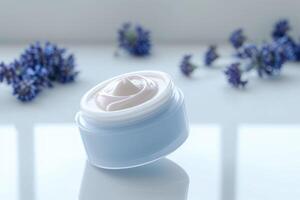 some purple flowers are laid out in front of clear cream, photo