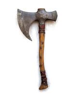 an old and worn ax with rustic leather straps, photo