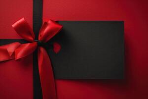 a folded card with red ribbon on it, photo