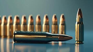 a single bullet and several bullet casings on a table, photo