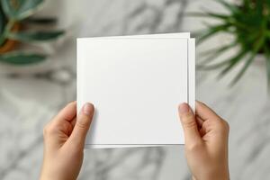 a person holds up this card as they pose for the camera, photo