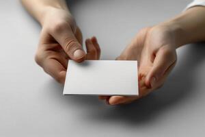 the woman is holding out blank greeting card, not enough for it to be shared, photo