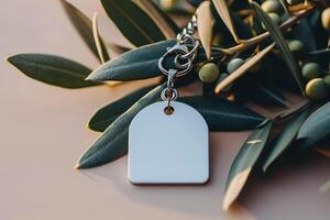 a plastic tag with chain attached to leaves, photo