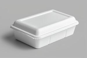 a closed container on top of some gray surface, photo