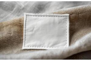 a white cloth with an embroidered square in the center, photo