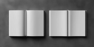 several open pages arranged in different sizes on a gray surface, photo