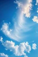 white clouds passing in the sky with the sun behind it, photo
