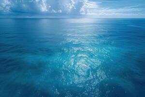 blue water with the sun reflecting off each of it, photo
