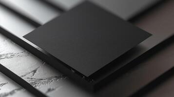 black, blank packaging sitting on top of an open book, photo