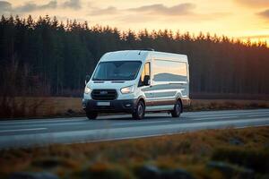 an empty van is driving along the road at sunset, photo