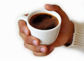 a hand holding a steaming cup of coffee, photo