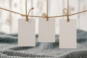 three blank price tags hanged to twin cord, photo