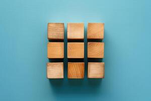 four wooden blocks sit on top of each other, photo