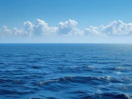 the ocean is blue with lots of clouds in it, photo