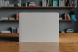 a square white box of something sitting on top of on a wooden table, photo