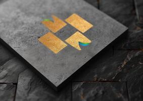 black, grey and gold business cards stacked on a table, photo