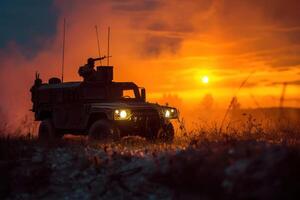an armored vehicle in the middle of a field at sunset, photo