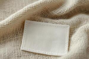 an unzipped piece of fabric is seen laying on the blanket, photo