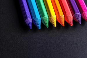 rainbow colored paints next to an empty bowl, photo