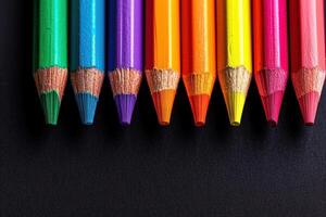 color pencils against black background, photo