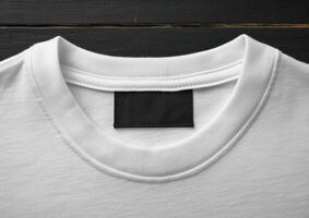 an empty shirt with a black label taped on the back, photo