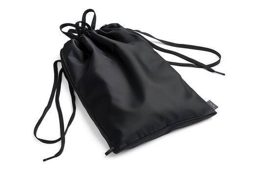 a drawstring case sitting on top of a table, photo