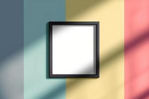 a black frame hangs on the wall in front of an empty rainbow striped space, photo
