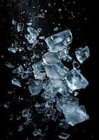 some ice cubes floating above the water with black background, photo