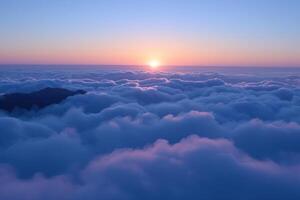 mountains above the clouds under blue sky, during sunset, photo