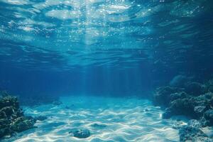 a large, blue ocean with white shallow water under the sunlight, photo