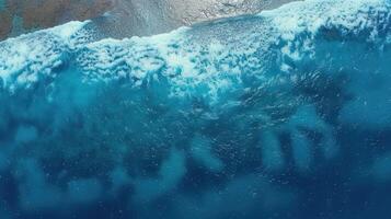 an aerial view of a man laying in the water on something, photo
