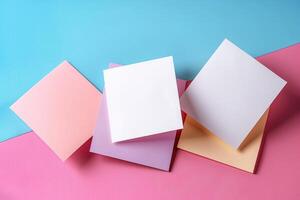 three square, paper boxes and a single sheet of colored paper, photo