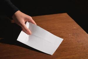 a person cutting paper with a knife, photo