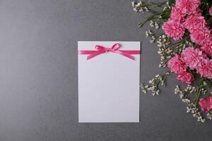 the card was left sitting on top of flowers, photo