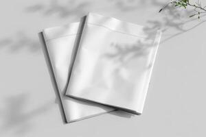 two papers with folded, un - unfolded folds on them, photo