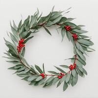 a wreath with some green leaves and red berries in it, photo