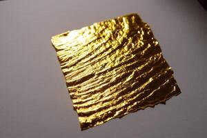 two pieces of foil next to each other, photo